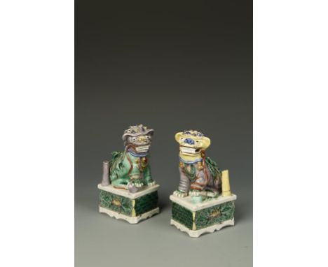 A PAIR OF CHINESE FAMILLE ROSE JOSS STICK HOLDERS, modelled as Buddhistic lions, Qing, 5" high (2)