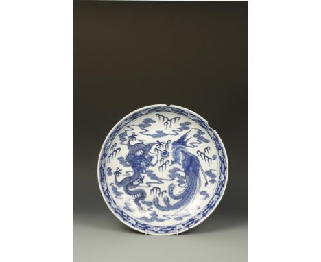 A CHINESE BLUE AND WHITE 'DRAGON & PHOENIX' CHARGER, Kangxi mark, Qing, 16" dia.