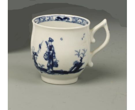 A WORCESTER BLUE AND WHITE PORCELAIN COFFEE CUP of bell-shape with wishbone handle and painted figures in landscape, workers 