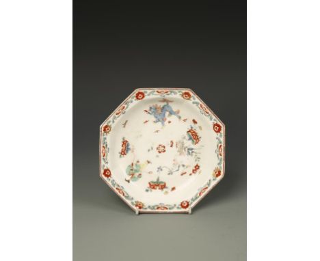 A BOW PORCELAIN OCTAGONAL-SHAPED DISH, decorated in polychrome Kakiemon style, with a figure, lions, flowers and figures, bro