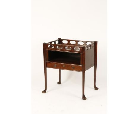 A MAHOGANY BEDSIDE COMMODE with pierced frieze and single drawer, on turned legs with pad feet, 18th century, 26" wide. See i