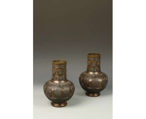 A PAIR OF JAPANESE BRONZE VASES with relief bands of decoration, Meiji, 9.75" high (2)