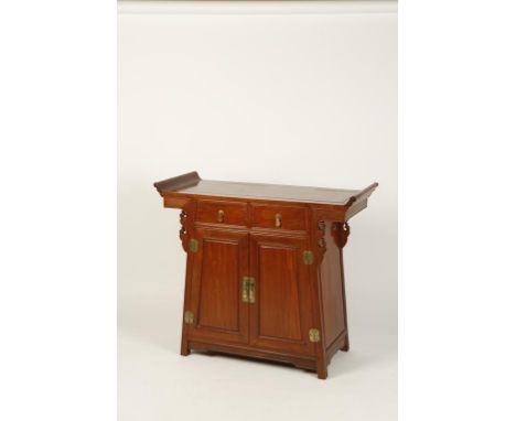 A CHINESE HARDWOOD ALTAR COFFER with scroll-end top above two drawers and cupboards with carved detailing, 38" wide