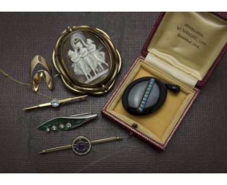 Six items of 19th and 20th century of jewellery, including a large three graces cameo brooch, a black enamel and turquoise lo
