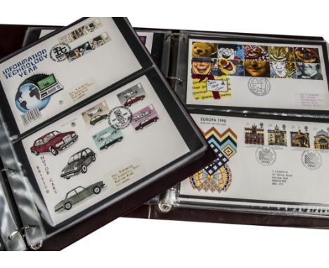 A collection of First Day Covers, including four albums with UK FDCs and two with Canadian examples, along with a Greg Norman