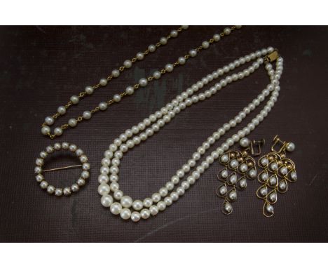 Four items of cultured pearl jewellery, including a pair of chandelier earrings, a twin strand necklace, a gilt and pearl nec