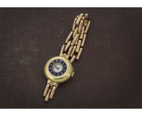 A vintage 18ct gold cased J.W. Benson half hunter lady's wristwatch, having blue enamel to outer cover, chip around 7, appear