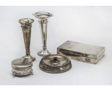 A George V silver circular trinket box, together with a silver cigarette box, two silver filled trumpet vases and a silver fi