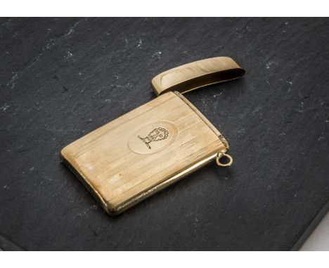 A vintage yellow metal vesta case, rectangular with slight curving, having engraved lines and head of a bearded man in cartou