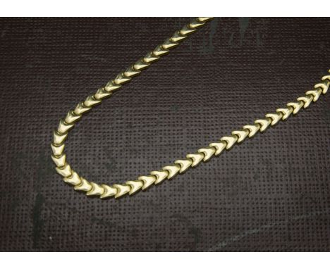 A 1970s 18ct gold necklace, the flattened arrow head links marked 18k to clasp, 21.8g 