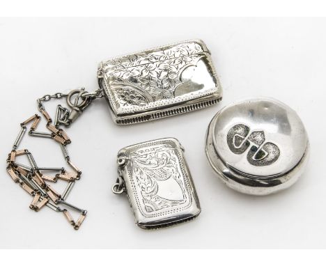 A small Austrian Art Nouveau silver pill box, lacking enamel, together with a silver vesta case with gold plated chain, and a