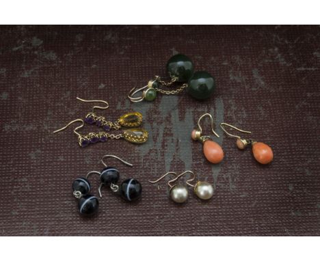 Five pairs of antique and vintage earrings, including a pair of two bead bullseye agate, a pair of coral drops, and three oth