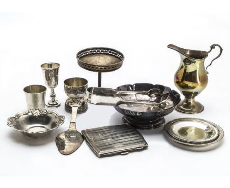 A collection of 19th and 20th century silver, including a pair of Victorian sugar tongs, a cream jug, small dishes, a bon bon