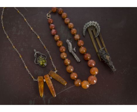 A collection of jewellery, including a carnelian bead necklace, a boxed white metal necklace, bracelet and earring set from t