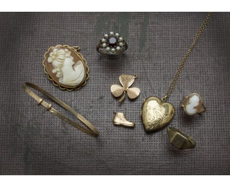 A 9ct gold garnet and seed pearl cluster dress ring, together with a 9ct gold and shell cameo ring and brooch, two 9ct gold c