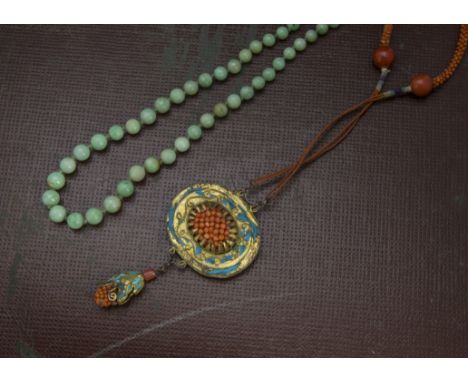 A vintage Chinese green hardstone bead necklace, similar to jade, 40cm, together with a fine Chinese coral bead necklace with