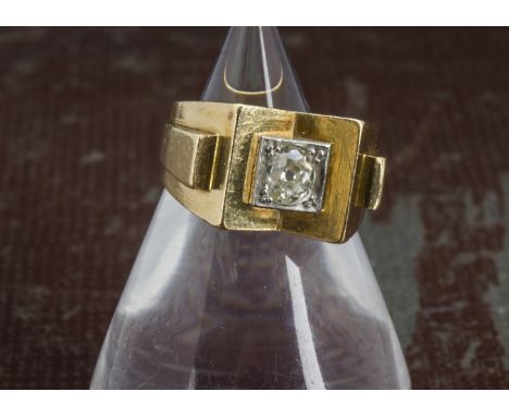 A 1960s Middle Eastern gold and diamond solitaire dress ring, the old cushion cut stone, approx 0.5ct, in Art Deco or Cubist 