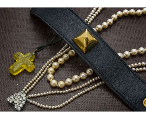 A modern Lalique yellow glass cross pendant, on leather with box, together with a boxed Hermes leather bracelet, two pairs of