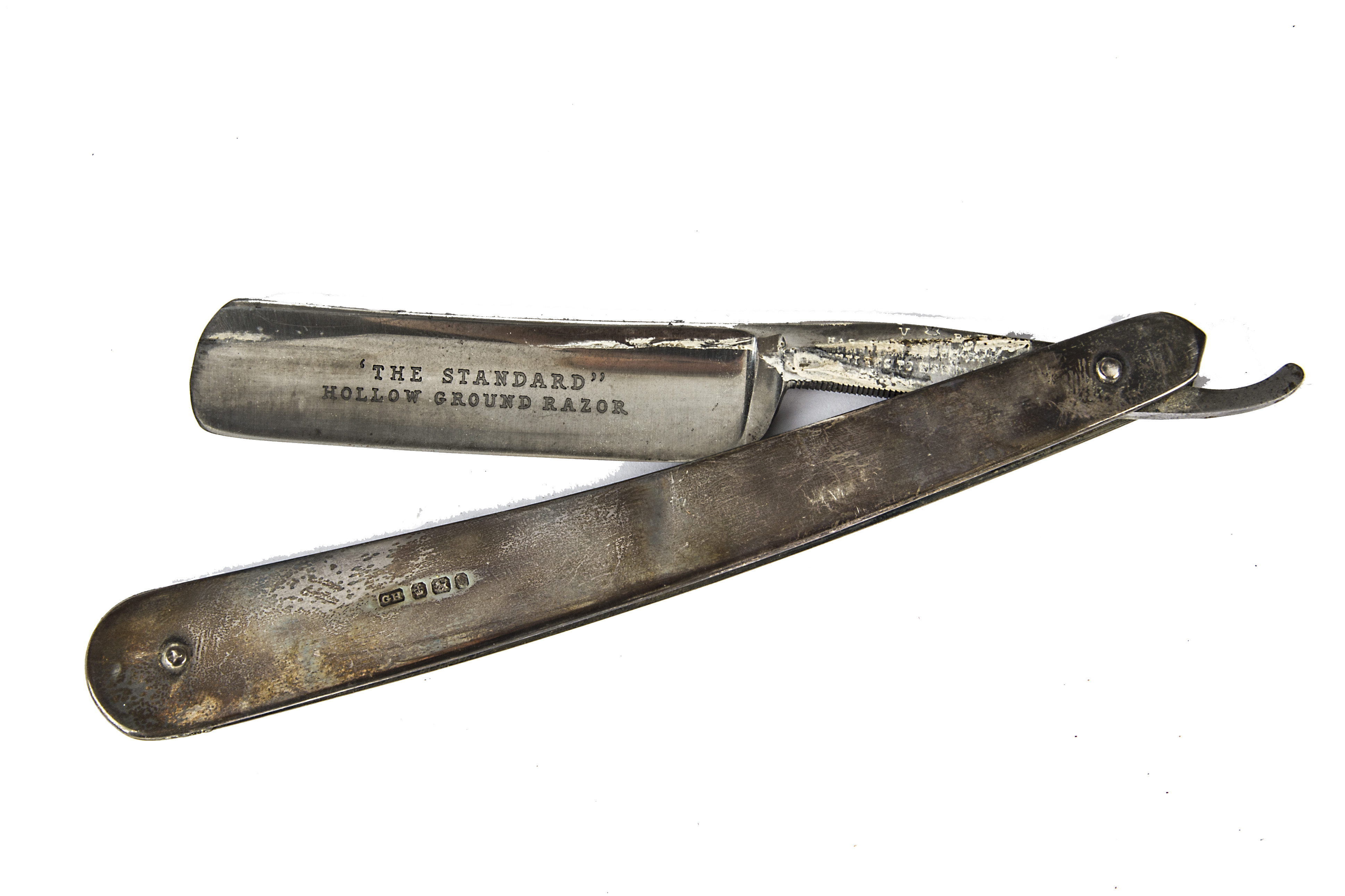 A late Victorian silver handled cut throat razor, dated Sheffield 1897, with card case (2)