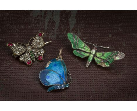 An Art Nouvea silver and enamel butterfly pendant by Child & Child, some enamel loss, together with a paste set butterfly bro