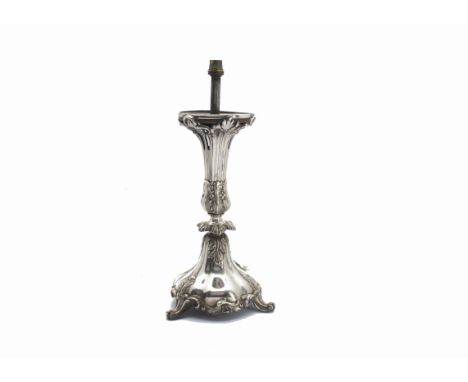 A Victorian silver table lamp base, the rococo themed base with three supports and decorated with leaves, 38.5cm and with lig