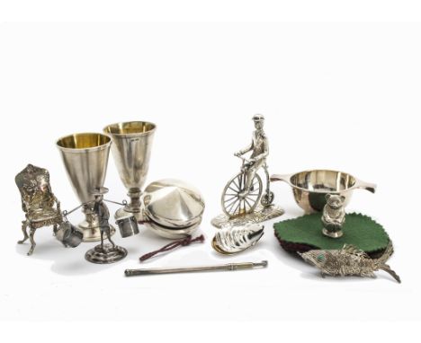 A collection of 20th century silver and white metal items, including a pair of Russian liquor goblets, a silver yoyo, a minia