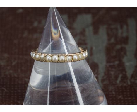 A Georgian gold and seed pearl eternity ring, lacking one pearl, 1.2g and size K 