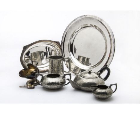 A collection of silver plated items, including a Christofle circular tray, a pepper grinder, toast rack, cocktail shaker, ent