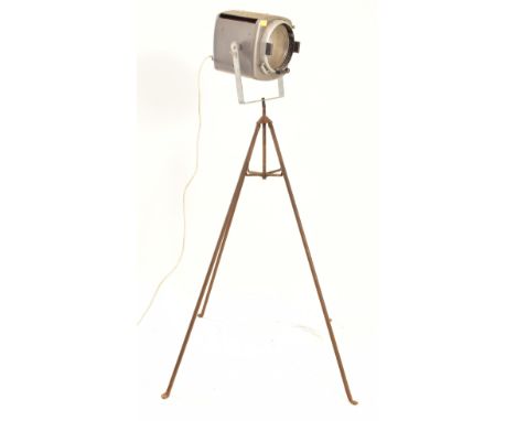 Strand Electric - A vintage 20th century metal stage theatre flash light on tripod stand. The light raised on a tripod stand.