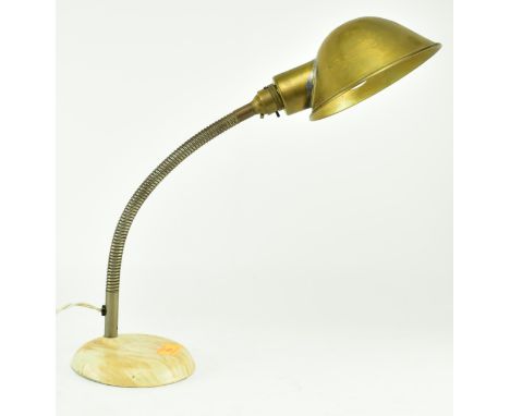 Universa - A retro mid 20th century British designed table / desk lamp light. The lamp having brass cup shade raised on a goo