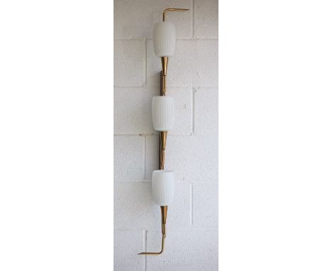 A retro mid century 1950s triple French wall light. The light having a teak wall mount with shaped brass arm supporting the t