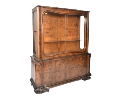 A large&nbsp; 20th century 1930s continental Art Deco walnut veneer bookcase cabinet. The cabinet top having twin glass slidi