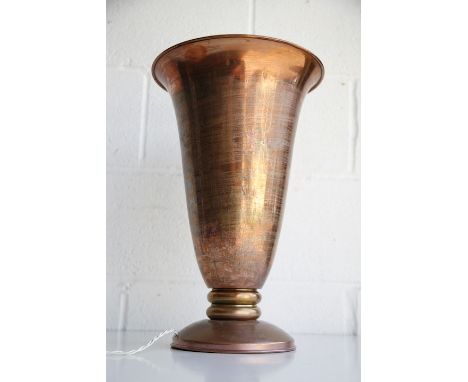 A large vintage 20th century Art Deco copper table lamp light. The lamp having a full length tapering copper shade with light