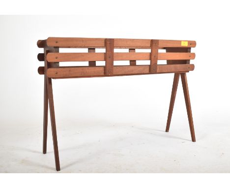 A retro 20th century teak wood plant stand / planter. The planter having a slatted teak wood body with metal tray set within.