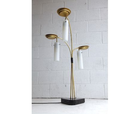 A retro 20th century 1960s Italian triple glass floor standing lamp light. The lamp having three gold metal stems with each h