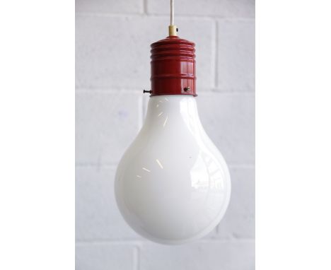 A retro 20th century 1970s giant light bulb hanging ceiling pendant light. White glass shade in the form of a light bulb with