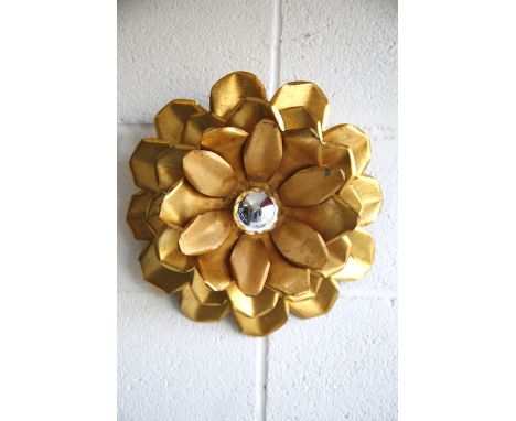 A retro 20th century 1970s Hollywood Regency flower head wall light. Central bulb fitting with three tiers of gold painted me