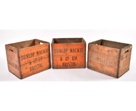 Three retro early - mid 20th century wooden wine cases, two Dunlop Mackie &amp; Co. Ltd of Bristol and one R. Whites. Largest