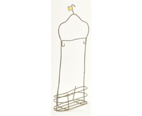 A vintage English mid 20th century circa 1940s metal swimming bath clothes hanger. The hanger having a hook top over a manneq