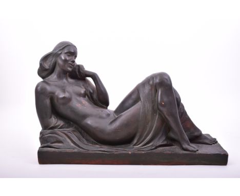 An early 20th century French Art Deco style black painted terracotta reclining nude lady. Signed Hamper to base. Measures app