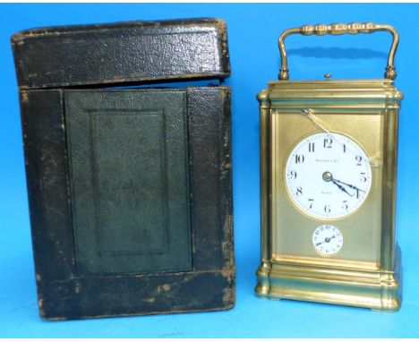 A French brass carriage clock by Baptiste & Cie, Bogata, with chiming repeat, height 6", in original leather case (front pane