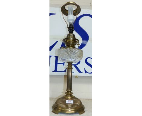A 19th century reeded brass oil lamp with cut glass reservoir and domed base (converted)