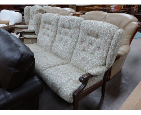 A modern 2 piece wing back suite in floral tapestry comprising 3 seater settee and armchair