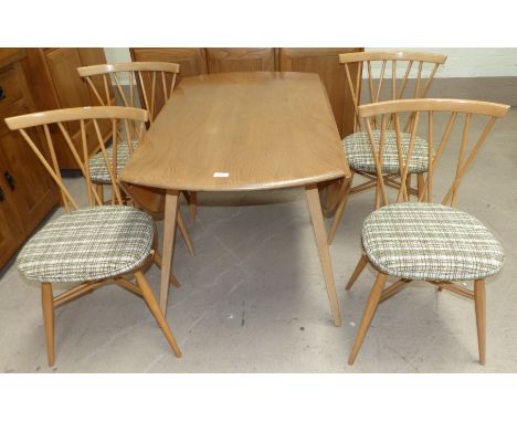 An Ercol elm and beech circular drop leaf table and a set of 4 matching cross rail back chairs