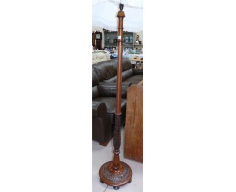 A 1920's carved mahogany standard lamp