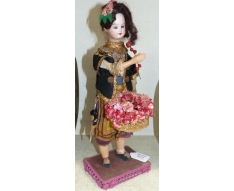 A flower automaton with bisque porcelain head, in Eastern costume, 13½"