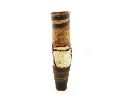 Robin Welch (1936-2019) - a tall stoneware studio pottery vase, of abstract cylindrical form, with flared rim, decorated with
