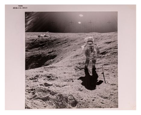Apollo 16 mission Nasa code AS16-114-18423Astronaut Charles Duke photographed collecting lunar samples at Station 120 x 25 cm