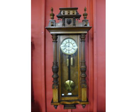 A 19th Century walnut Vienna double weight wall clock 