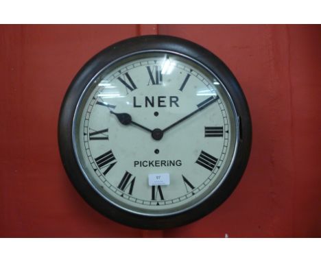 A beech circular wall clock, bearing LNER Pickering inscription to the dial 